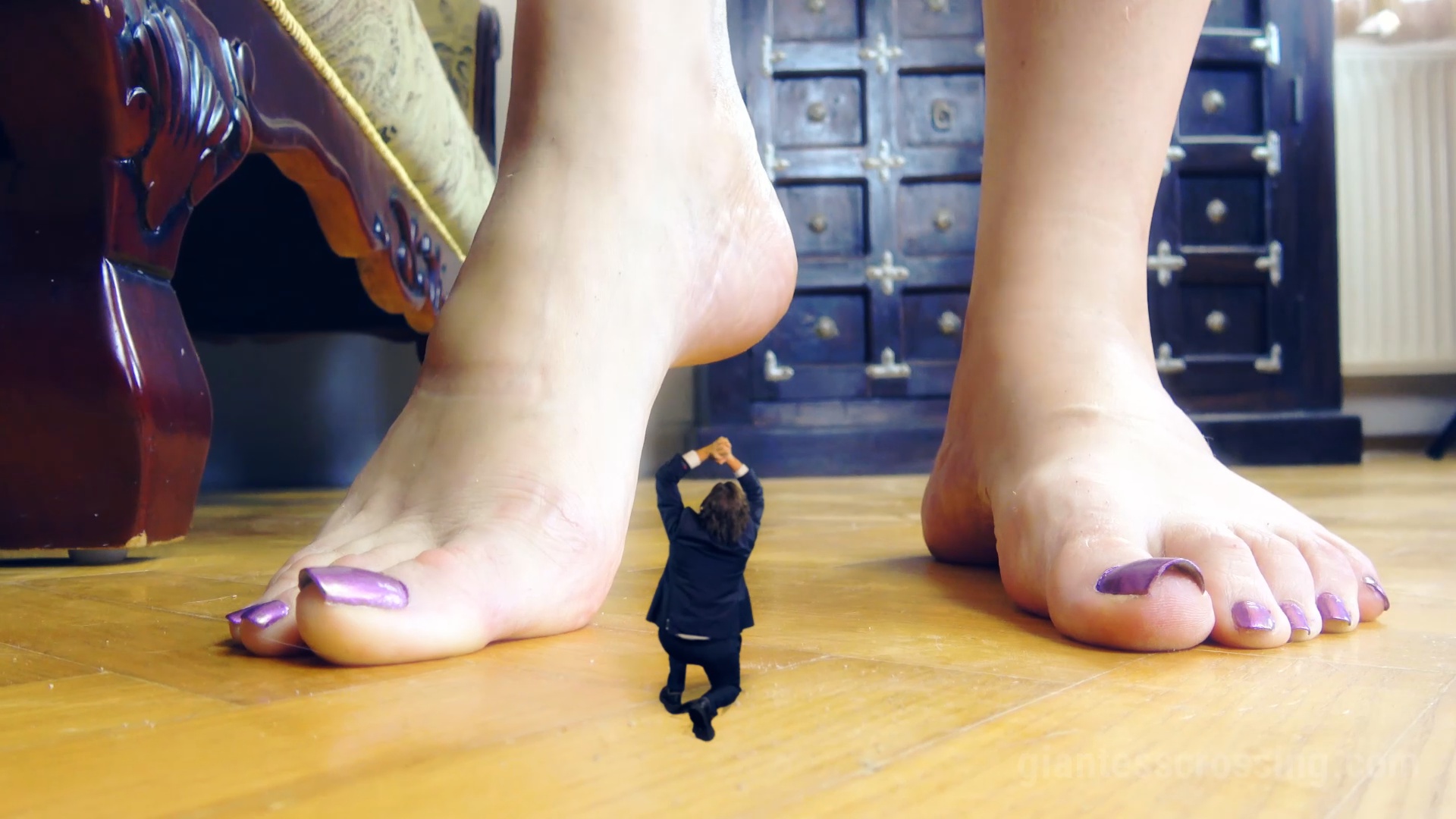 Giantess abuses destroy tiny with foot photo